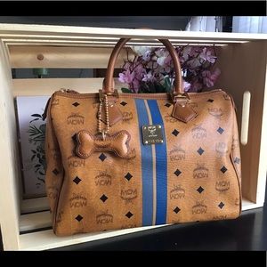 MCM boston bag with bone charm.